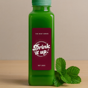 **Alt text:** Green bottled mint drink labeled “Drink it up! – The Mint Series” with fresh mint leaves beside it, showcasing Fresh Pudina Juice In Malappuram made for natural refreshment.